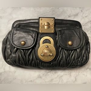 Steven by Steve Madden Lana soft black leather gold turn lock clutch.